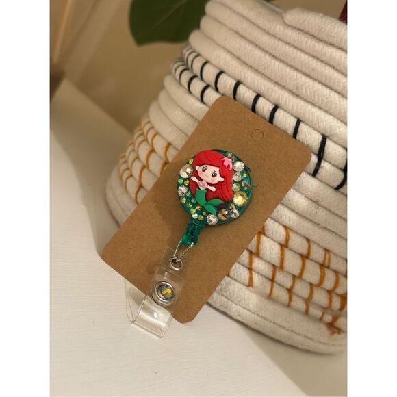 The Little Mermaid Ariel Rhinestone Red and Green Badge Reel - Picture 1 of 2